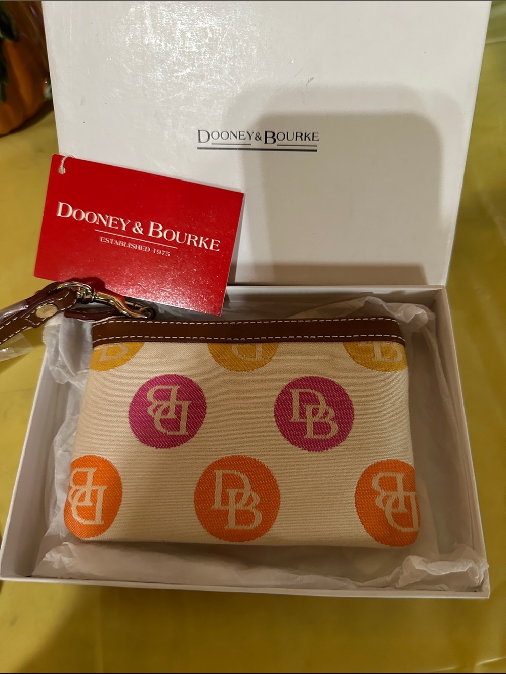 Dooney & Bourke Beige Canvas Wristlet with Pink & Orange Logo Dots